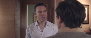 Movie still from “The Tribes of Palos Verdes” (2017), directed by Brendan Malloy – A man standing in front of a mirror talking to another man; Close Up shot, Over the shoulder angle