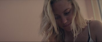 Movie still from “The Tribes of Palos Verdes” (2017), directed by Brendan Malloy – A woman with long blonde hair looking down at her face; Close Up shot, Over the shoulder angle
