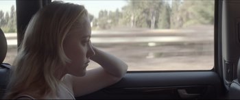 Movie still from “The Tribes of Palos Verdes” (2017), directed by Brendan Malloy – A young girl looking out the window of a car; Close Up shot, Over the shoulder angle