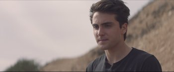 Movie still from “The Tribes of Palos Verdes” (2017), directed by Brendan Malloy – A person wearing a black t - shirt; Close Up shot, Over the shoulder angle