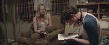 Movie still from “The Tribes of Palos Verdes” (2017), directed by Brendan Malloy – A woman sitting on a couch next to a man; Medium shot, Over the shoulder angle