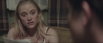 Movie still from “The Tribes of Palos Verdes” (2017), directed by Brendan Malloy – A woman sitting on a couch looking at the camera; Close Up shot, Over the shoulder angle