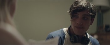 Movie still from “The Tribes of Palos Verdes” (2017), directed by Brendan Malloy – A young man with headphones is sitting in a room; Close Up shot, Over the shoulder angle