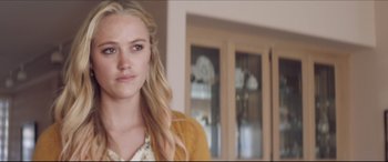 Movie still from “The Tribes of Palos Verdes” (2017), directed by Brendan Malloy – A woman with long blonde hair standing in a living room; Close Up shot, Over the shoulder angle