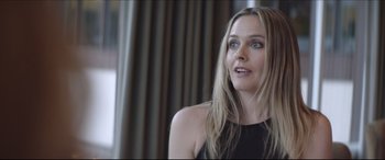 Movie still from “The Tribes of Palos Verdes” (2017), directed by Brendan Malloy – A woman with long blonde hair wearing a black top; Close Up shot, Over the shoulder angle