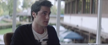 Movie still from “The Tribes of Palos Verdes” (2017), directed by Brendan Malloy – A young man is looking out a window; Close Up shot, Over the shoulder angle