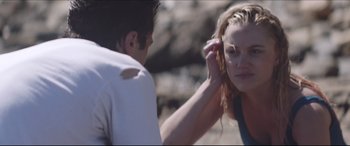 Movie still from “The Tribes of Palos Verdes” (2017), directed by Brendan Malloy – A man and a woman in the sand by the ocean; Close Up shot, Over the shoulder angle