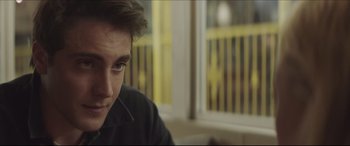 Movie still from “The Tribes of Palos Verdes” (2017), directed by Brendan Malloy – A person sitting in front of a window; Close Up shot, Over the shoulder angle