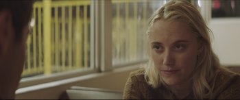 Movie still from “The Tribes of Palos Verdes” (2017), directed by Brendan Malloy – A woman sitting in front of a window; Close Up shot, Over the shoulder angle