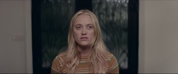 Movie still from “The Tribes of Palos Verdes” (2017), directed by Brendan Malloy – A woman with long blonde hair wearing a striped shirt; Close Up shot, Over the shoulder angle