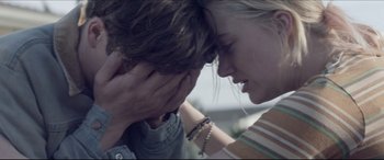 Movie still from “The Tribes of Palos Verdes” (2017), directed by Brendan Malloy – A woman holding her head with a man touching her face; Close Up shot, Over the shoulder angle