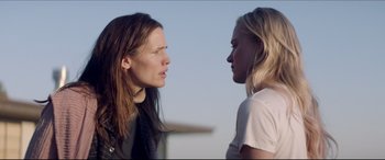 Movie still from “The Tribes of Palos Verdes” (2017), directed by Brendan Malloy – Two women facing each other in a public place; Close Up shot, Over the shoulder angle