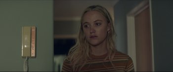 Movie still from “The Tribes of Palos Verdes” (2017), directed by Brendan Malloy – A woman with long blonde hair wearing a striped shirt; Close Up shot, Over the shoulder angle