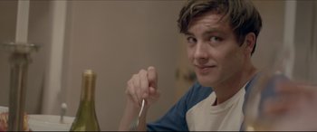 Movie still from “The Tribes of Palos Verdes” (2017), directed by Brendan Malloy – A young man holding a fork in his hand; Close Up shot, Over the shoulder angle