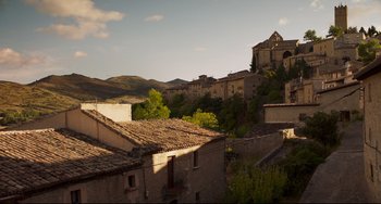 Movie still from “The Trip to Spain” (2017), directed by Michael Winterbottom – An image of an old building in the middle of the day; Extreme Wide shot, Low angle