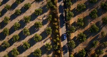 Movie still from “The Trip to Spain” (2017), directed by Michael Winterbottom – An aerial view of a car driving down a road; Extreme Wide shot, Overhead angle