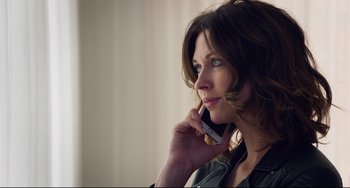 Movie still from “The Trip to Spain” (2017), directed by Michael Winterbottom – A beautiful woman talking on a cell phone; Close Up shot, Low angle