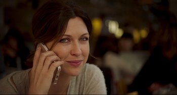 Movie still from “The Trip to Spain” (2017), directed by Michael Winterbottom – A woman is talking on a cell phone; Close Up shot, Low angle