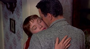Movie still from “The Trouble with Harry” (1955), directed by Alfred Hitchcock – A man and a woman embracing each other; Close Up shot, Overhead angle