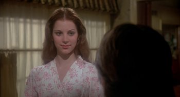 Movie still from “The Turning Point” (1977), directed by Herbert Ross – A young woman in a floral robe looking into a mirror; Close Up shot, Over the shoulder angle