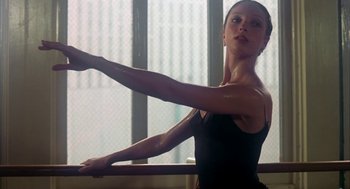 Movie still from “The Turning Point” (1977), directed by Herbert Ross – A woman in a leotard stretching on a barre; Close Up shot, Low angle