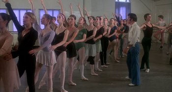 Movie still from “The Turning Point” (1977), directed by Herbert Ross – A group of young ballerinas standing next to each other in front of an instructor; Wide shot, High angle