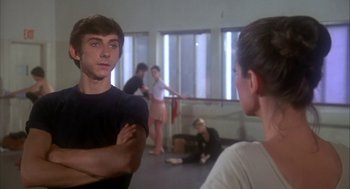 Movie still from “The Turning Point” (1977), directed by Herbert Ross – A group of young people in a room; Medium shot, Over the shoulder angle