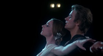 Movie still from “The Turning Point” (1977), directed by Herbert Ross – A man and a woman are standing in the dark; Close Up shot, Low angle