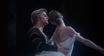 Movie still from “The Turning Point” (1977), directed by Herbert Ross – A man and a woman are dancing on a stage; Medium shot, Low angle