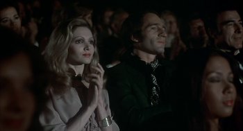 Movie still from “The Turning Point” (1977), directed by Herbert Ross – A man and a woman sitting in front of each other; Medium shot, Low angle