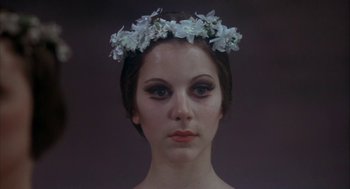 Movie still from “The Turning Point” (1977), directed by Herbert Ross – A woman wearing a white flower crown; Close Up shot, Low angle