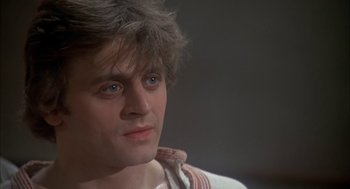 Movie still from “The Turning Point” (1977), directed by Herbert Ross – A person wearing a shirt; Close Up shot, Low angle