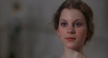 Movie still from “The Turning Point” (1977), directed by Herbert Ross – A person wearing a dress; Close Up shot, Low angle