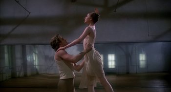 Movie still from “The Turning Point” (1977), directed by Herbert Ross – A man and a woman are dancing in a room; Medium shot, Low angle
