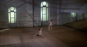 Movie still from “The Turning Point” (1977), directed by Herbert Ross – Two people are performing a dance in a room; Wide shot, High angle