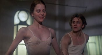 Movie still from “The Turning Point” (1977), directed by Herbert Ross – A man and a woman are dancing in a room; Medium shot, Low angle