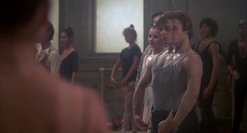 Movie still from “The Turning Point” (1977), directed by Herbert Ross – A group of young men standing in a dance studio; Medium shot, Low angle