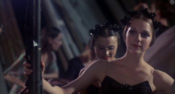 Movie still from “The Turning Point” (1977), directed by Herbert Ross – A woman in a black dress looking in a mirror; Close Up shot, Over the shoulder angle
