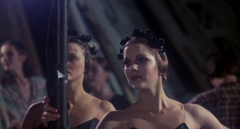 Movie still from “The Turning Point” (1977), directed by Herbert Ross – A woman in a black dress looking at herself in the mirror; Close Up shot, Low angle