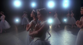 Movie still from “The Turning Point” (1977), directed by Herbert Ross – A group of young ballerinas are posing for a picture; Medium shot, Low angle