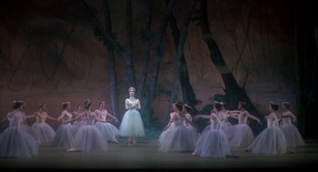 Movie still from “The Turning Point” (1977), directed by Herbert Ross – A group of ballerinas in white tutus on a stage; Wide shot, Low angle