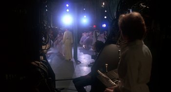 Movie still from “The Turning Point” (1977), directed by Herbert Ross – A group of people standing in the middle of a room; Wide shot, Over the shoulder angle