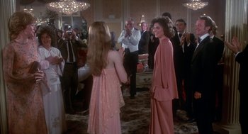 Movie still from “The Turning Point” (1977), directed by Herbert Ross – A group of people standing in front of a crowd; Medium shot, Over the shoulder angle