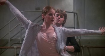 Movie still from “The Turning Point” (1977), directed by Herbert Ross – A man and a woman are dancing in a room; Medium shot, Low angle
