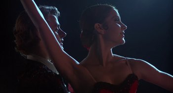 Movie still from “The Turning Point” (1977), directed by Herbert Ross – A man and a woman are dancing on a stage; Close Up shot, Low angle