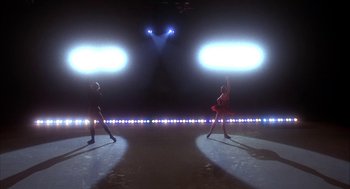 Movie still from “The Turning Point” (1977), directed by Herbert Ross – Two people are performing a dance on a stage; Extreme Wide shot, Low angle