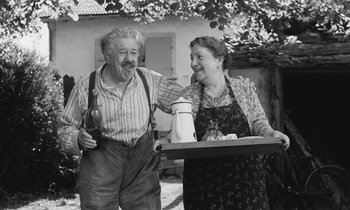 Movie still from “The Two of Us” (1967), directed by Claude Berri – An older man standing next to an older woman; Medium shot, Low angle