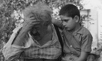 Movie still from “The Two of Us” (1967), directed by Claude Berri – An older woman and a young boy are holding their heads together; Close Up shot, High angle