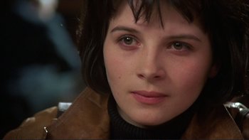 Movie still from “The Unbearable Lightness of Being” (1988), directed by Philip Kaufman – A woman's face in a leather jacket; Close Up shot, Over the shoulder angle