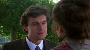 Movie still from “The Unbearable Lightness of Being” (1988), directed by Philip Kaufman – A man and a woman talking to each other; Close Up shot, Over the shoulder angle